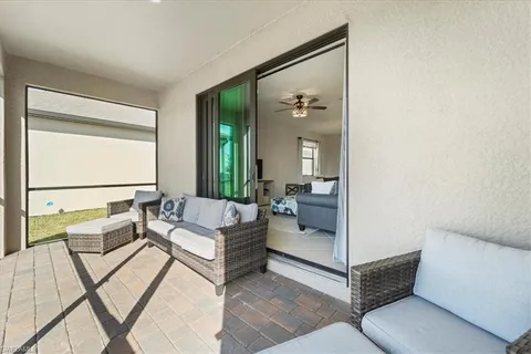 a living room with furniture and a gate