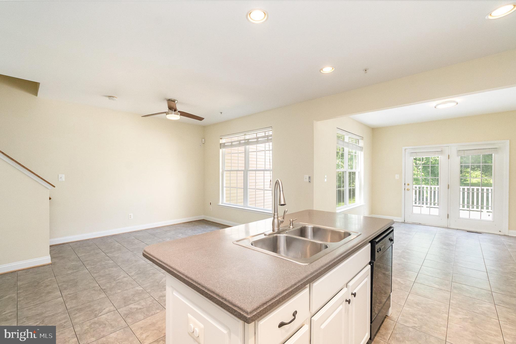 512 Callander Way Abingdon, MD 21009 - Photo 14 of 40 a kitchen with a sink stove and cabinets