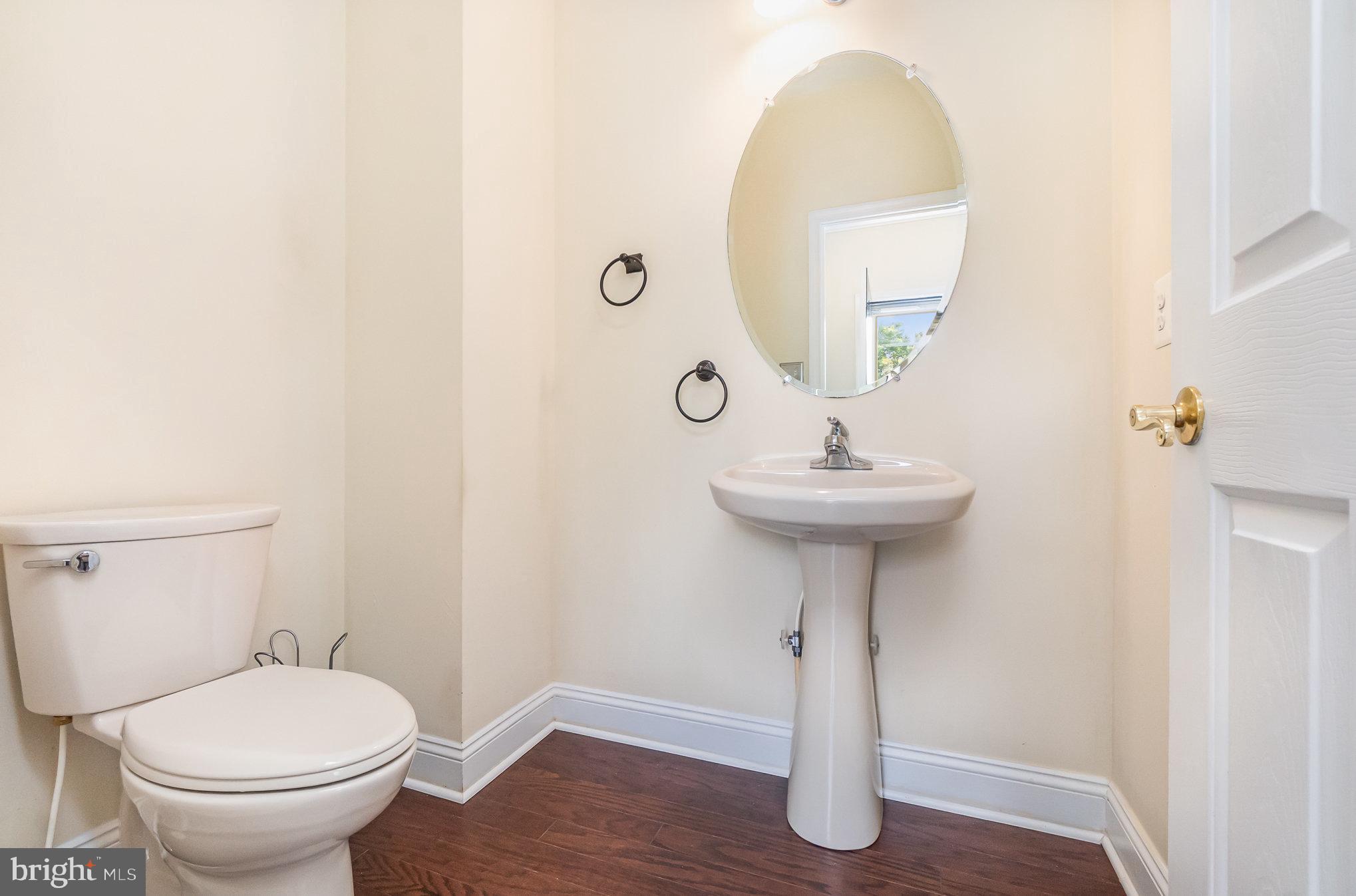 512 Callander Way Abingdon, MD 21009 - Photo 18 of 40 a bathroom with a sink toilet and a mirror