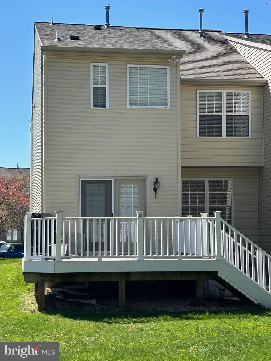 512 Callander Way Abingdon, MD 21009 - Photo 5 of 40 a view of a house with a deck and a yard