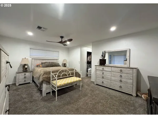 a bedroom with a bed and furniture
