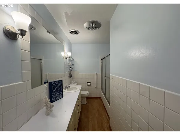 a bathroom with a sink and shower