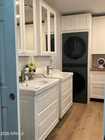 a utility room with a sink a washer and dryer