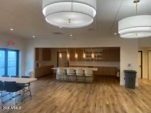 a lobby with furniture and chandelier