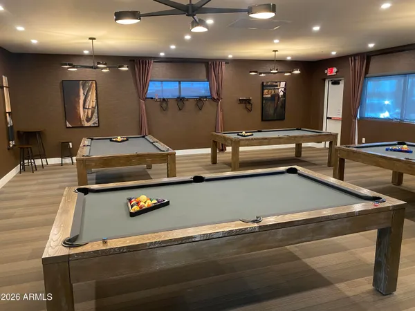 a view of a room with kitchen island a sink and a couch