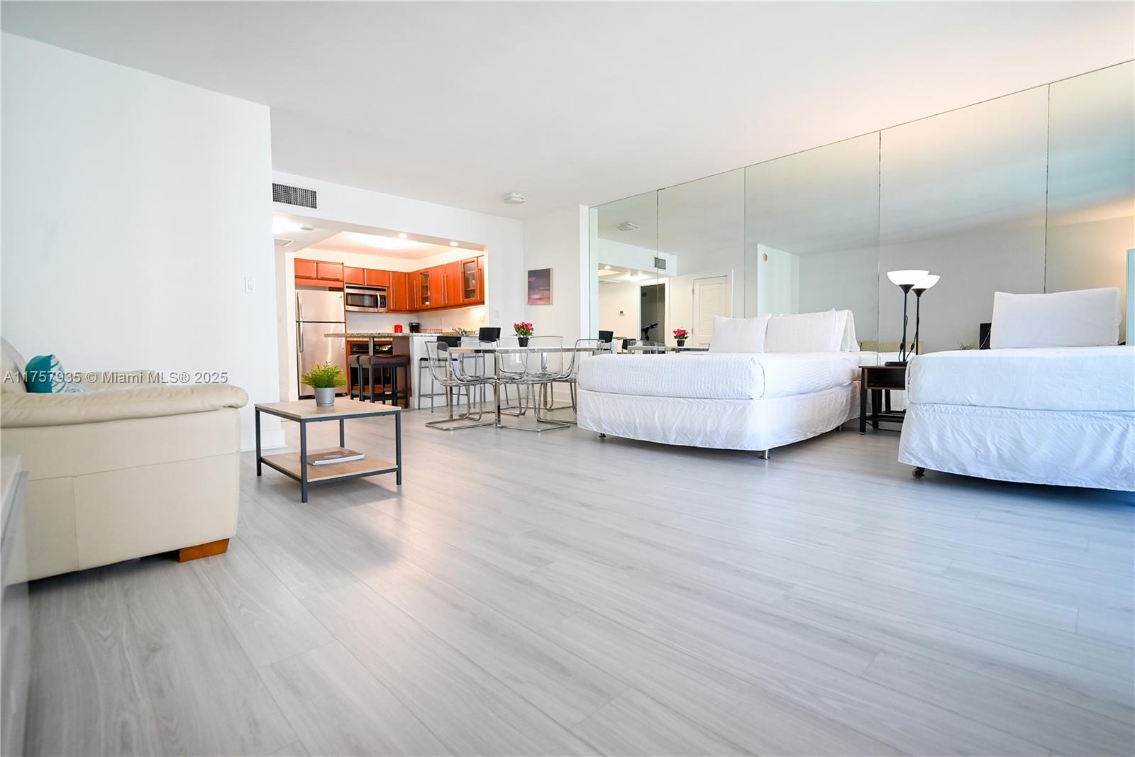 2301 Collins Avenue, Unit 921 Miami Beach, FL 33139 - Photo 12 of 45 a living room with furniture and a wooden floor