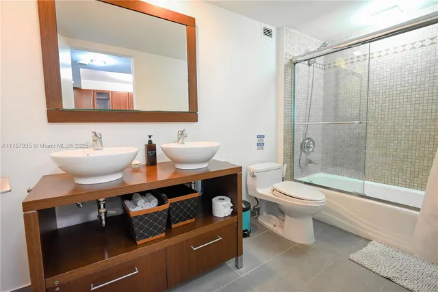 a bathroom with a toilet a sink and a bathtub