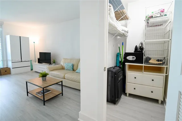 a balcony with table and chairs