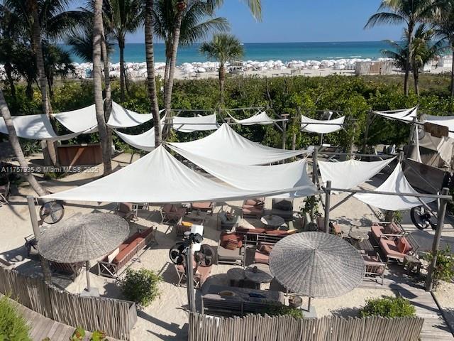 2301 Collins Avenue, Unit 921 Miami Beach, FL 33139 - Photo 41 of 45 an outdoor space with furniture and umbrella