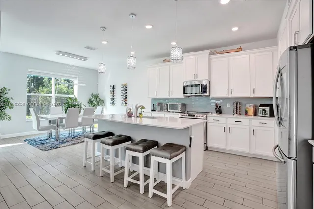 a kitchen with a sink cabinets and window