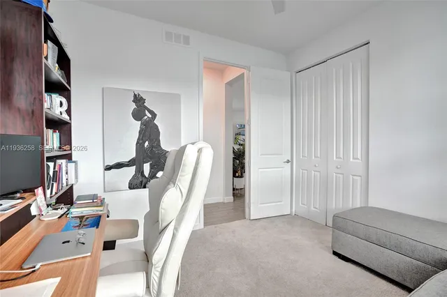 a view of a livingroom with furniture and windows