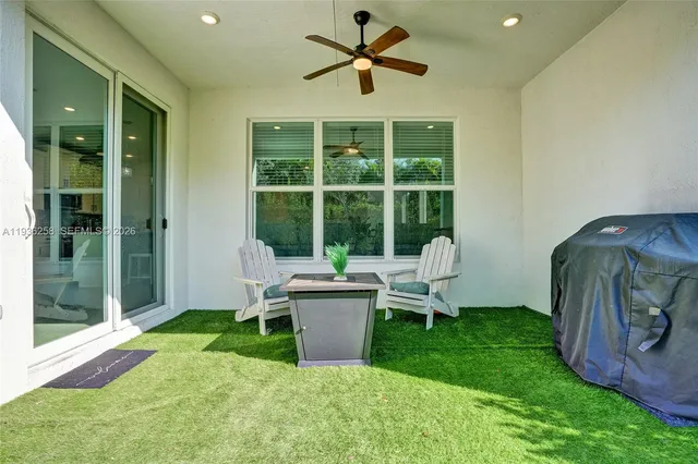 a living room with furniture and a yard