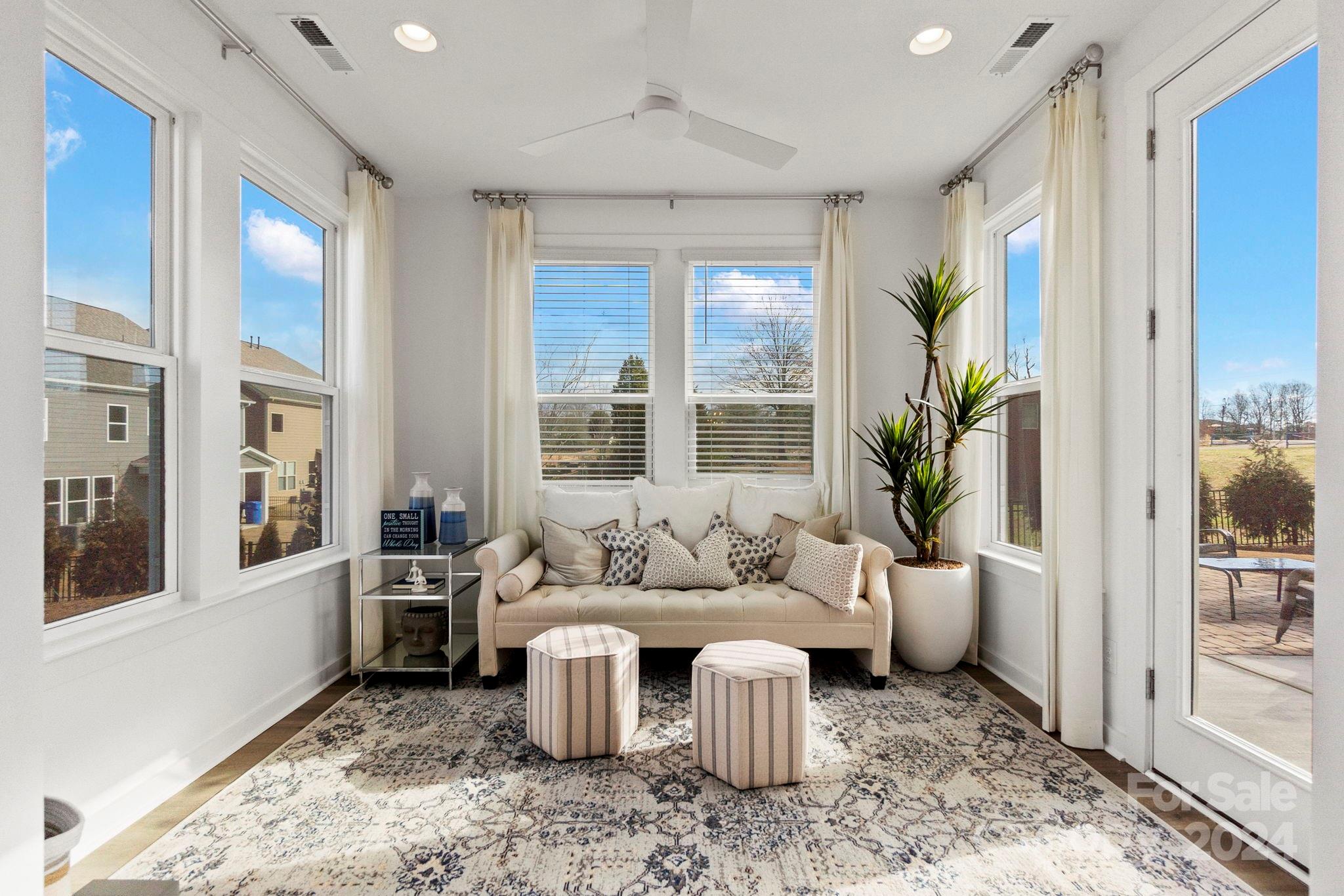 13228 Chopin Ridge Road Huntersville, NC 28078 - Photo 13 of 37 a living room with furniture a large window and a table