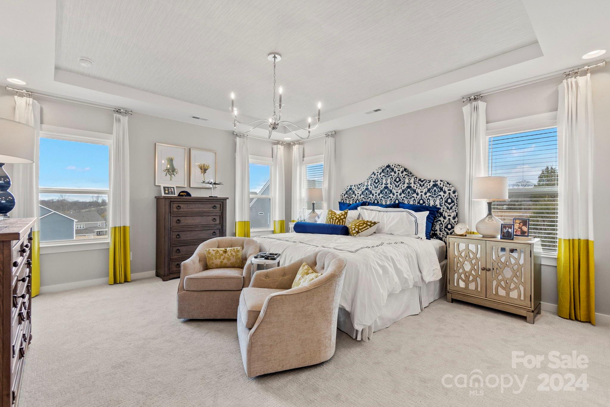 13228 Chopin Ridge Road Huntersville, NC 28078 - Photo 23 of 37 a spacious bedroom with a bed and a couch