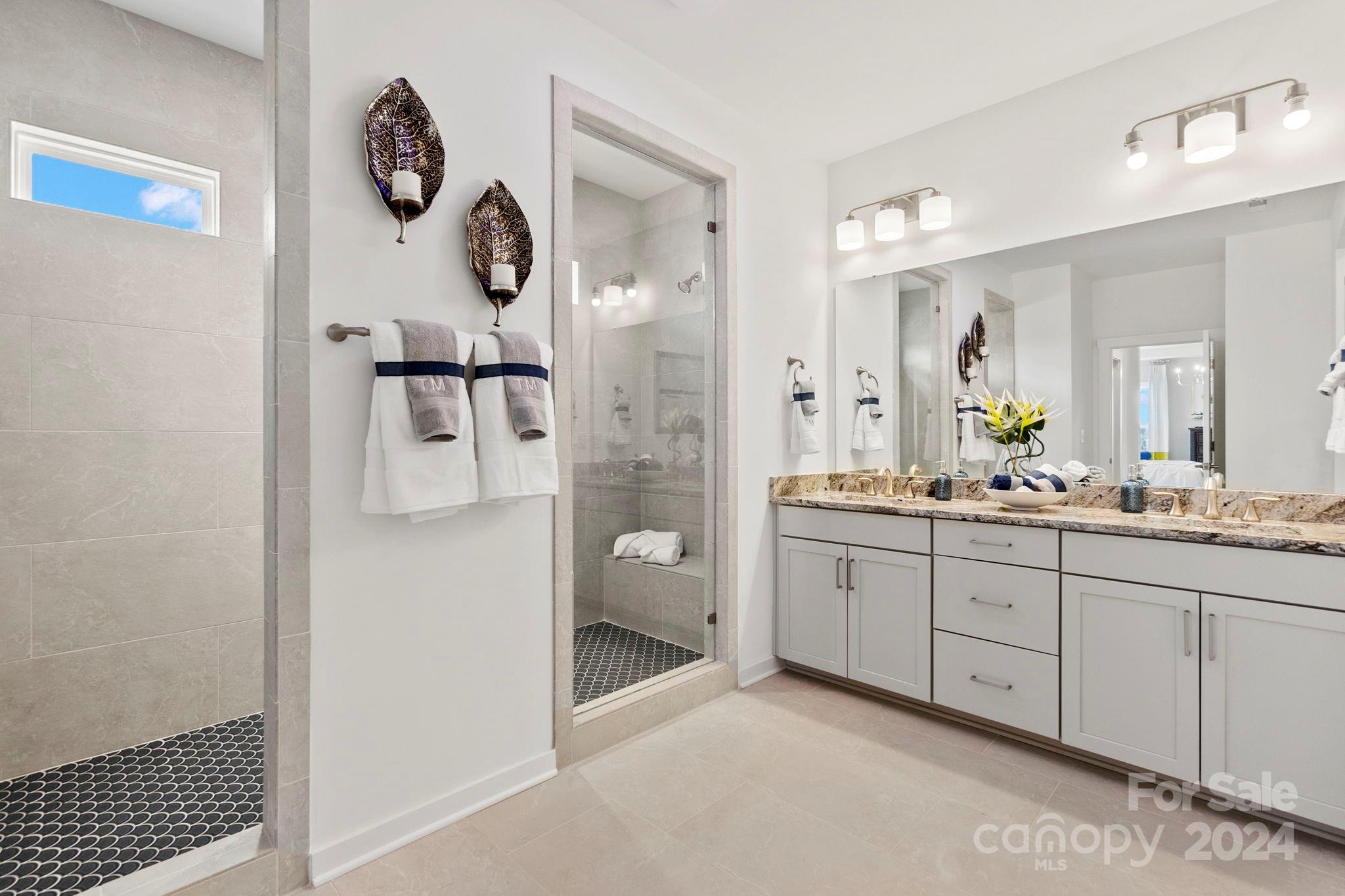 13228 Chopin Ridge Road Huntersville, NC 28078 - Photo 27 of 37 a spacious bathroom with a granite countertop sink mirror and toilet