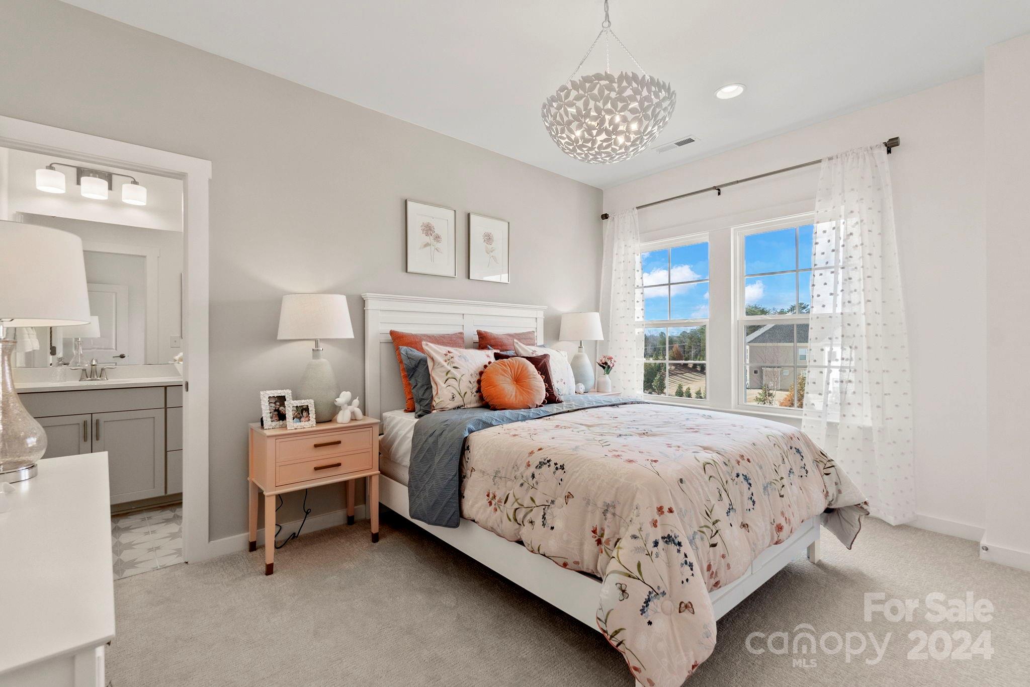 13228 Chopin Ridge Road Huntersville, NC 28078 - Photo 33 of 37 a bedroom with bed and a window