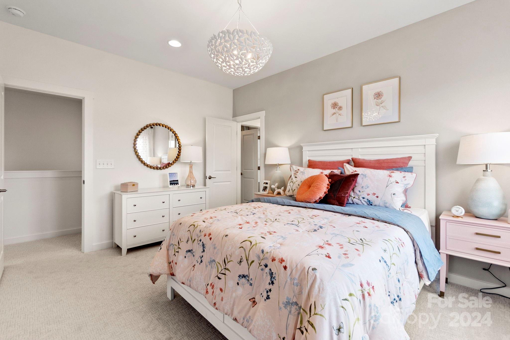 13228 Chopin Ridge Road Huntersville, NC 28078 - Photo 34 of 37 a bedroom with bed and a chandelier