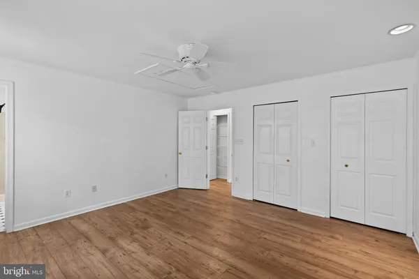 a view of an empty room and wooden floor