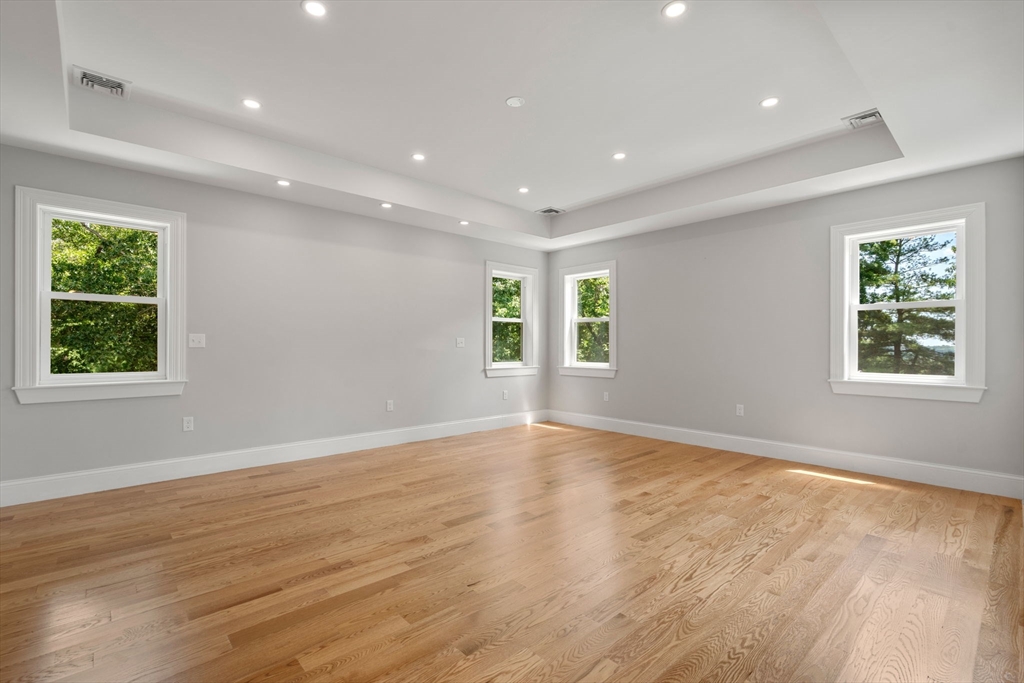 19 Brooks Road Gloucester, MA 01930 - Photo 19 of 32 an empty room with wooden floor and windows