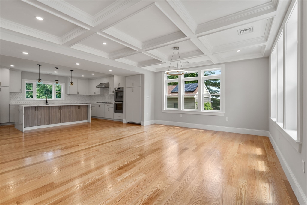 19 Brooks Road Gloucester, MA 01930 - Photo 2 of 32 a view of an empty room with window and wooden floor