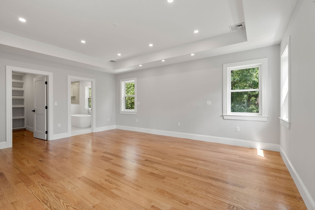 19 Brooks Road Gloucester, MA 01930 - Photo 21 of 32 an empty room with wooden floor and windows