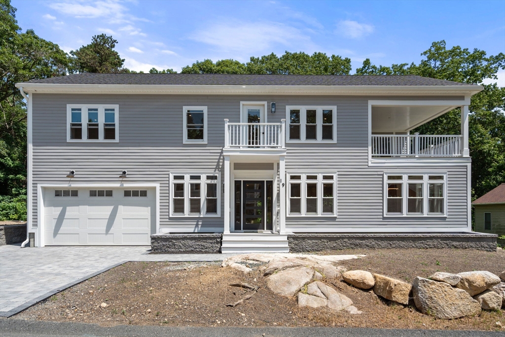 19 Brooks Road Gloucester, MA 01930 - Photo 28 of 32 a front view of a house with a garage