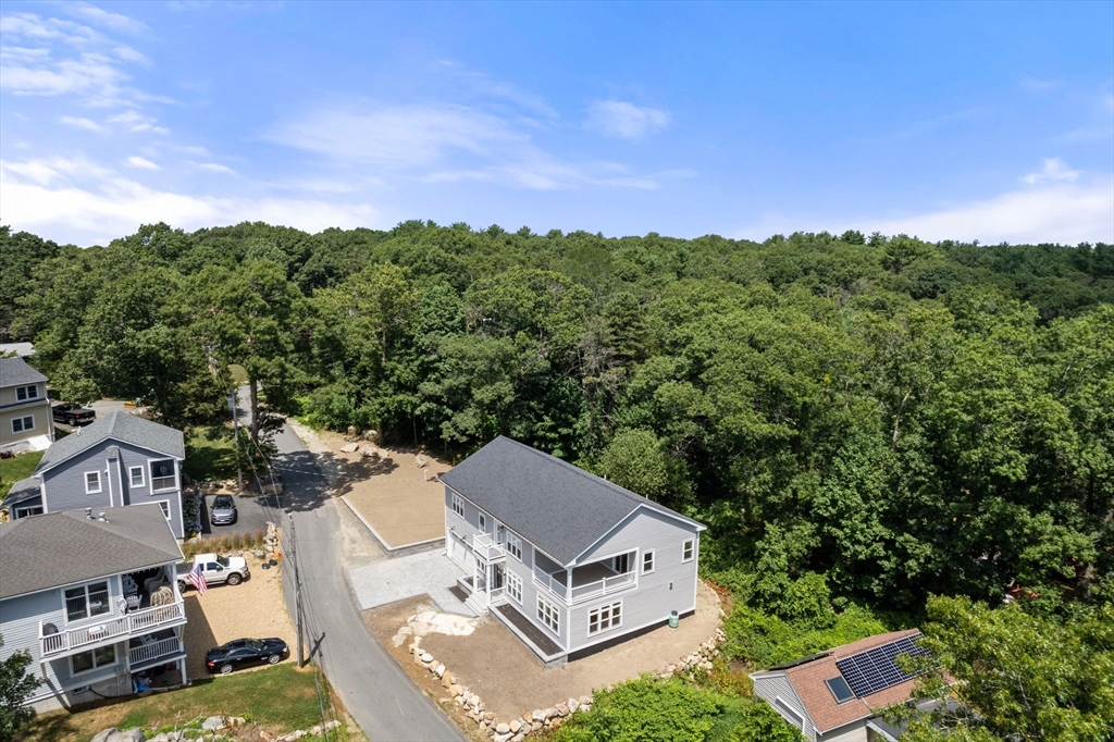 19 Brooks Road Gloucester, MA 01930 - Photo 29 of 32 an aerial view of a house with a garden