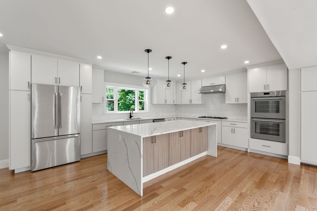 19 Brooks Road Gloucester, MA 01930 - Photo 6 of 32 a kitchen with stainless steel appliances granite countertop a refrigerator a stove a sink and a oven