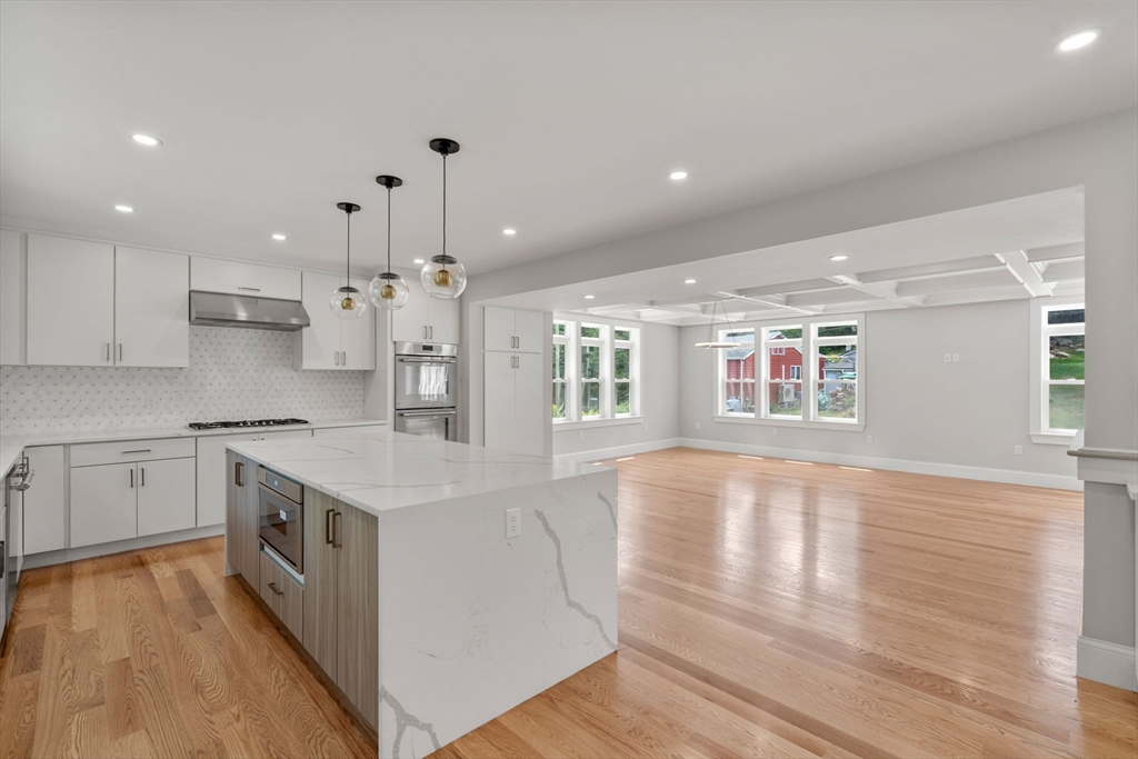 19 Brooks Road Gloucester, MA 01930 - Photo 8 of 32 a large kitchen with stainless steel appliances granite countertop a lot of counter space and wooden floors