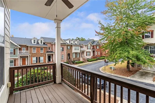 a view of a balcony with seating space
