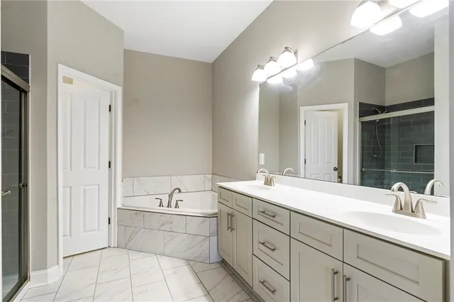 a bathroom with a sink double vanity and a mirror