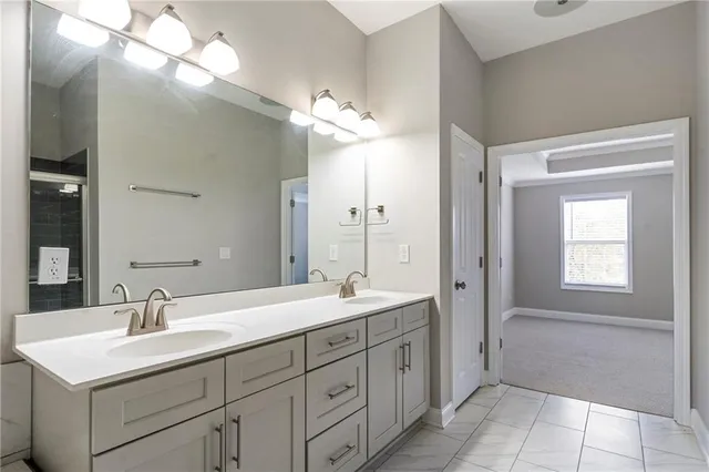 a bathroom with a sink double vanity and a mirror
