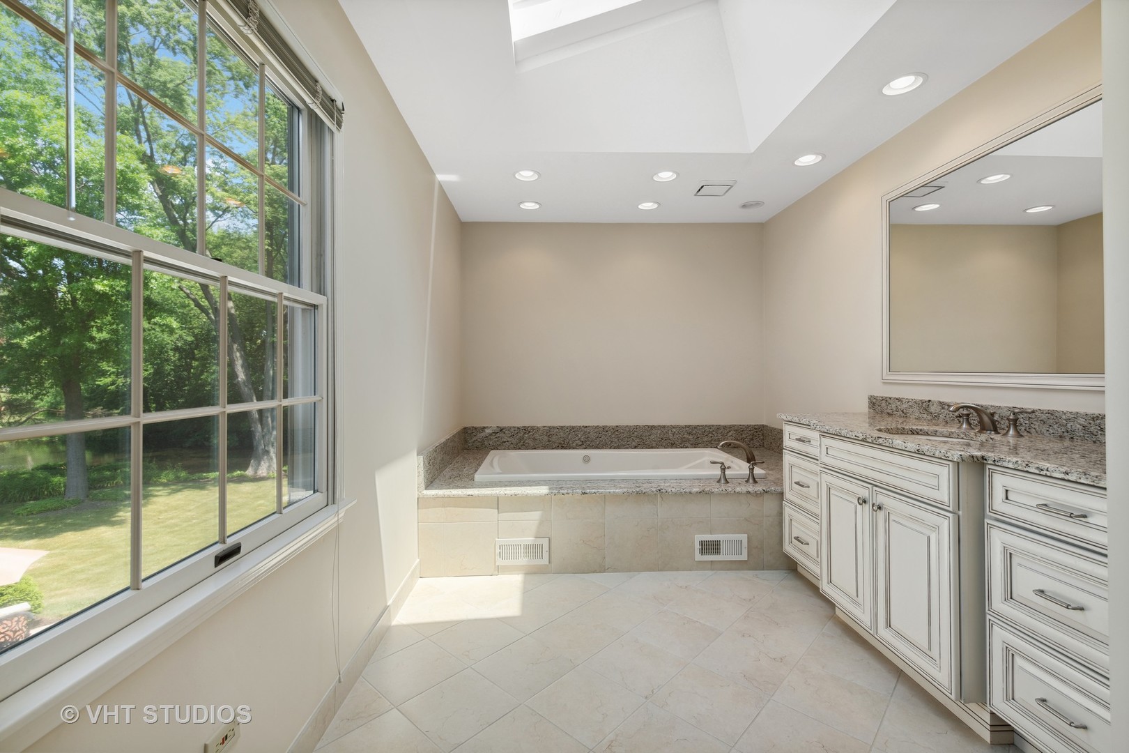 275 Old Mill Road Barrington, IL 60010 - Photo 20 of 45 a bathroom with a granite countertop sink and a bathtub