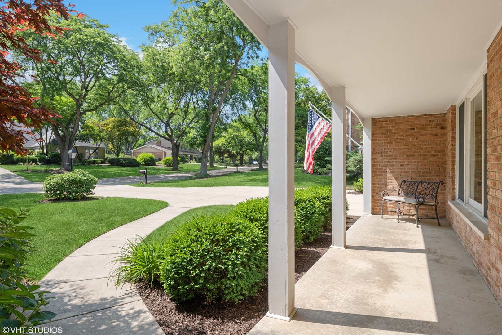 275 Old Mill Road Barrington, IL 60010 - Photo 2 of 45 a view of porch with a big yard potted plants and large tree