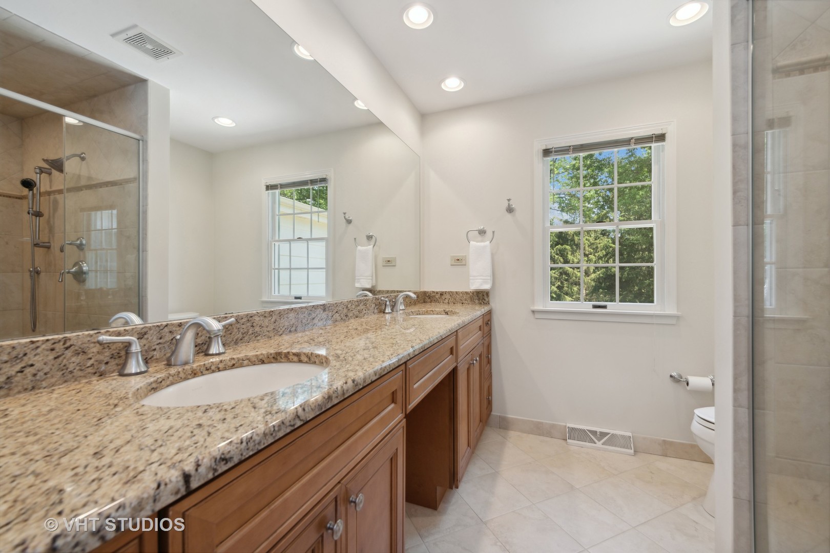 275 Old Mill Road Barrington, IL 60010 - Photo 24 of 45 a bathroom with a granite countertop sink and a large mirror