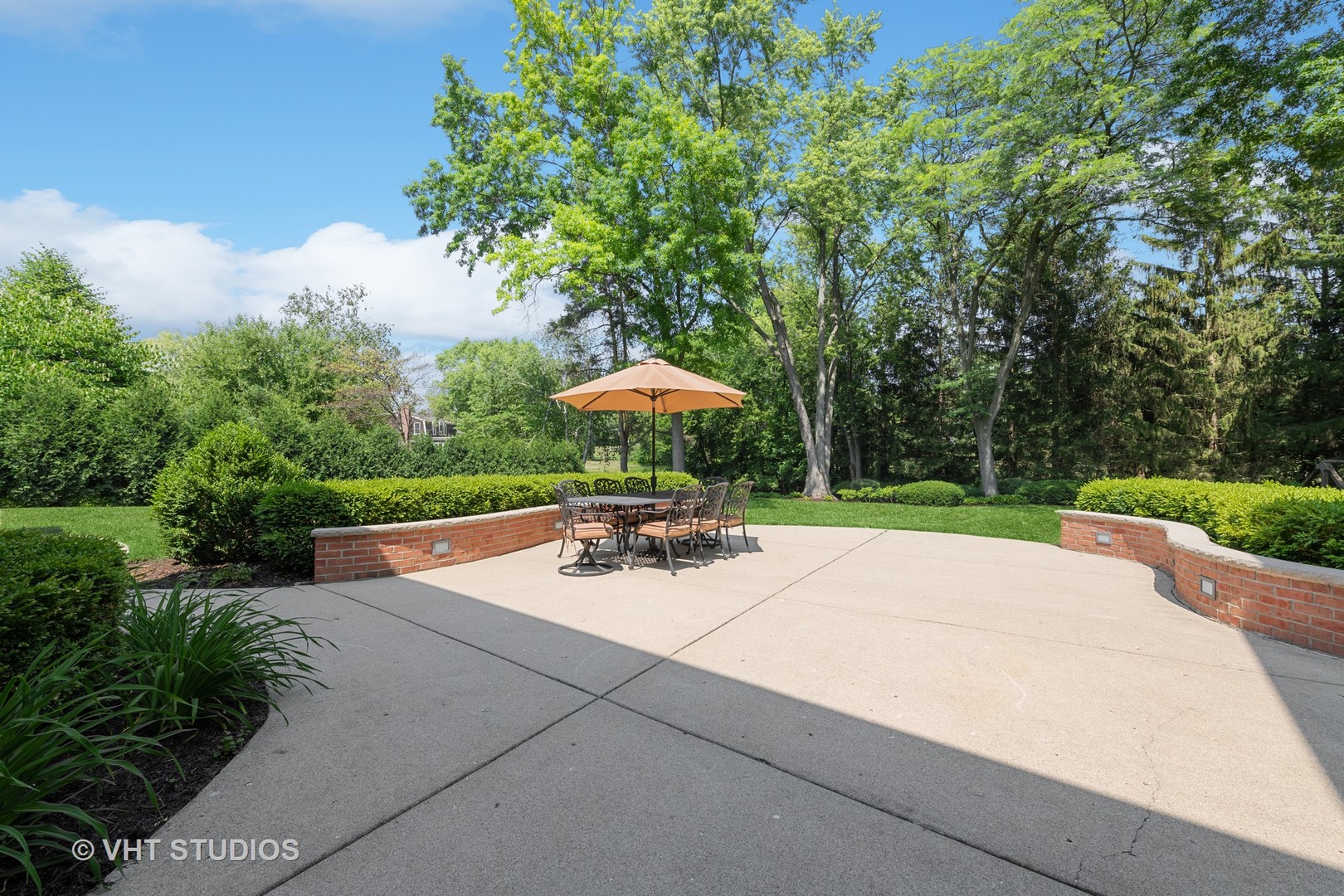 275 Old Mill Road Barrington, IL 60010 - Photo 34 of 45 a view of a patio with a table and chairs under an umbrella