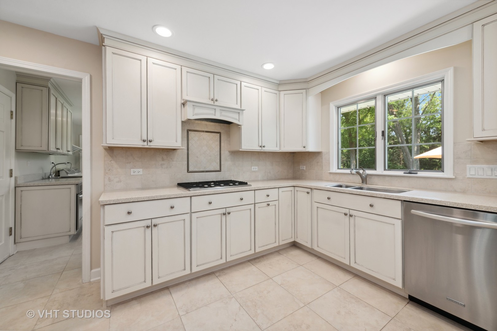 275 Old Mill Road Barrington, IL 60010 - Photo 8 of 45 a kitchen with cabinets appliances a sink and a window
