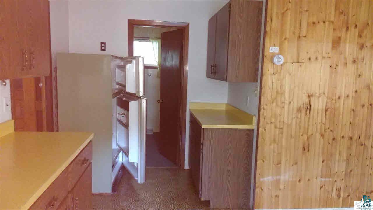 7496 Nancy Lake Road Minong, WI 54859 - Photo 5 of 19 From kitchen sink showing pantry area and into Bathroom