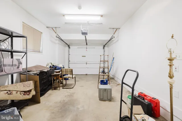 a bedroom with a bed and a dresser in it