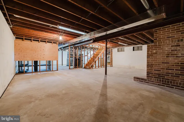 a view of an empty room with stairs