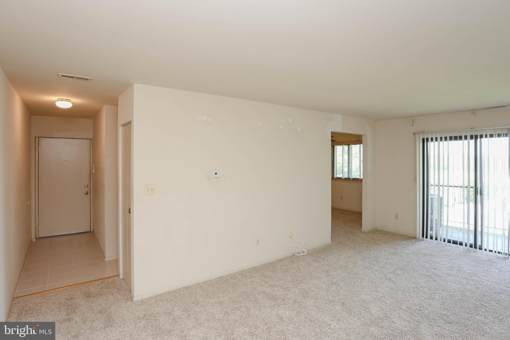 1000 Spring Gate Road, Unit 3C Catonsville, MD 21228 - Photo 7 of 17 Living Room leading to patio