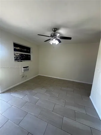 a kitchen with a sink and a refrigerator