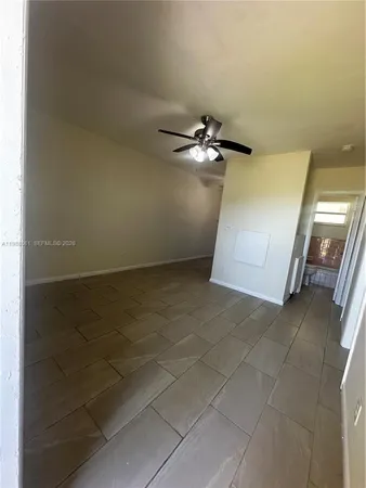 a view of an empty room with a bathroom