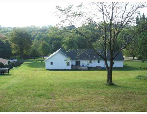 403 Parker Road Sarver, PA 16055 - Photo 4 of 18 Exterior Back. Private back deck and yard. Located up and above Parker Road to ensure quality of privacy and scenic views.
