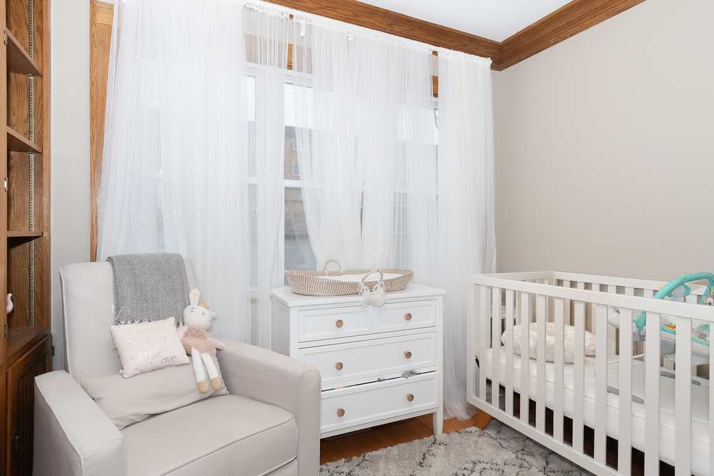 1234 Maple Avenue Berwyn, IL 60402 - Photo 12 of 25 a bedroom with a bed and a window