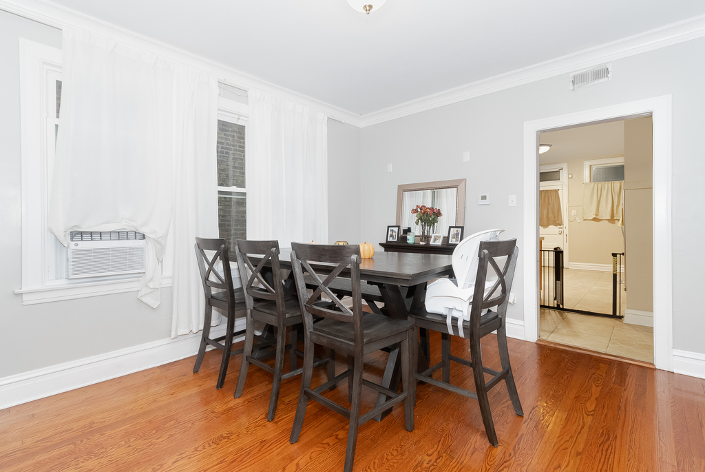 1234 Maple Avenue Berwyn, IL 60402 - Photo 15 of 25 a view of a dining room with furniture and wooden floor