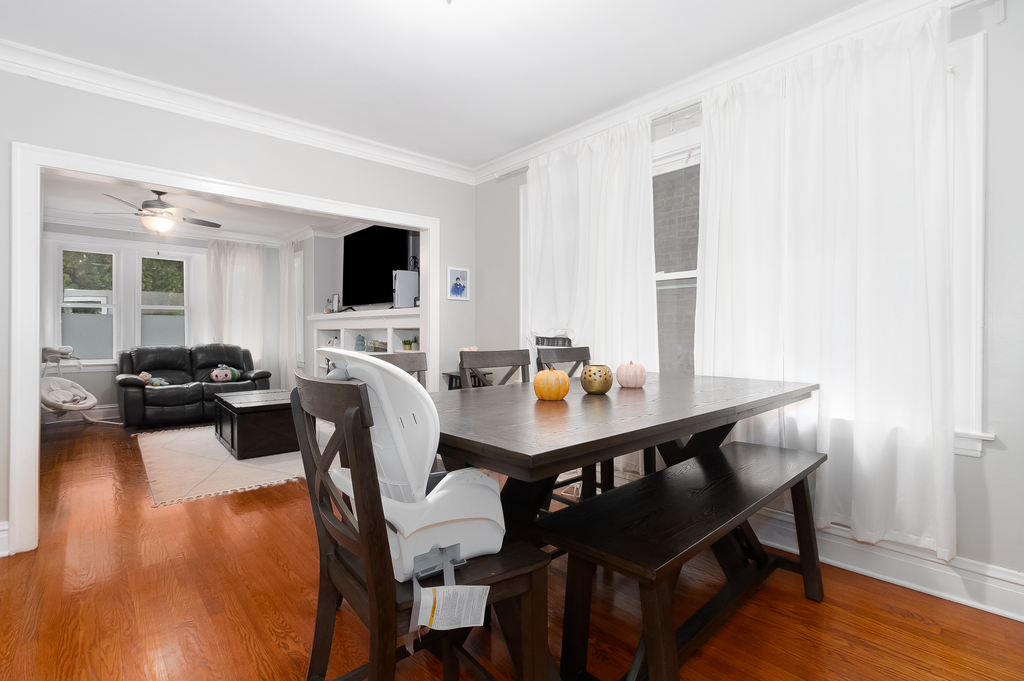 1234 Maple Avenue Berwyn, IL 60402 - Photo 16 of 25 a view of a dining room with furniture and wooden floor