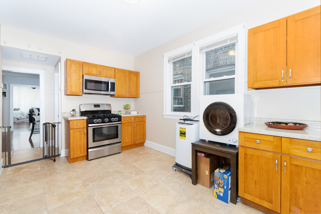 1234 Maple Avenue Berwyn, IL 60402 - Photo 17 of 25 a kitchen with a stove and a sink