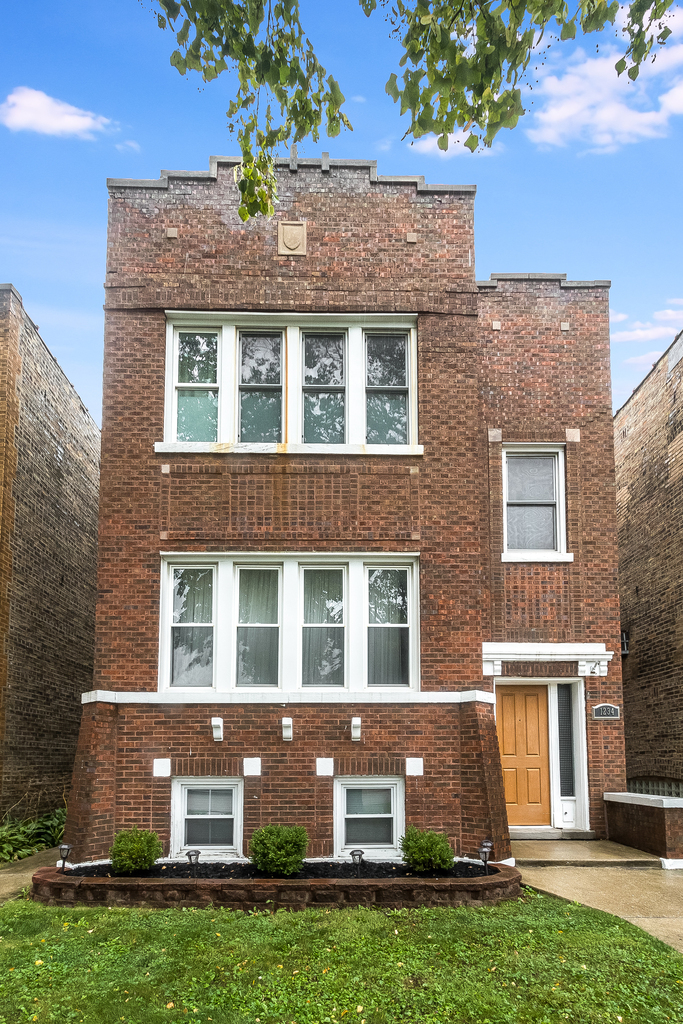 1234 Maple Avenue Berwyn, IL 60402 - Photo 2 of 25 a front view of a house with garden