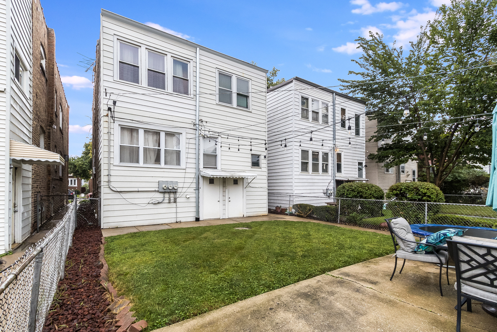 1234 Maple Avenue Berwyn, IL 60402 - Photo 24 of 25 a view of a house with a yard and sitting area